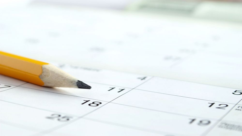 calendar and a pencil to mark the desired date